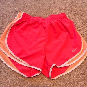Hot pink with orange Nike athletic shorts
